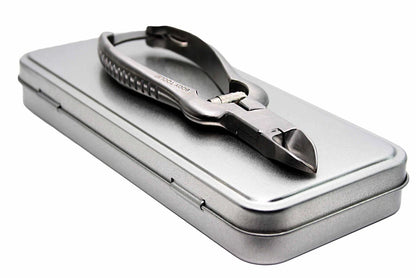 Metallic nail nipper in a tin box on a white background